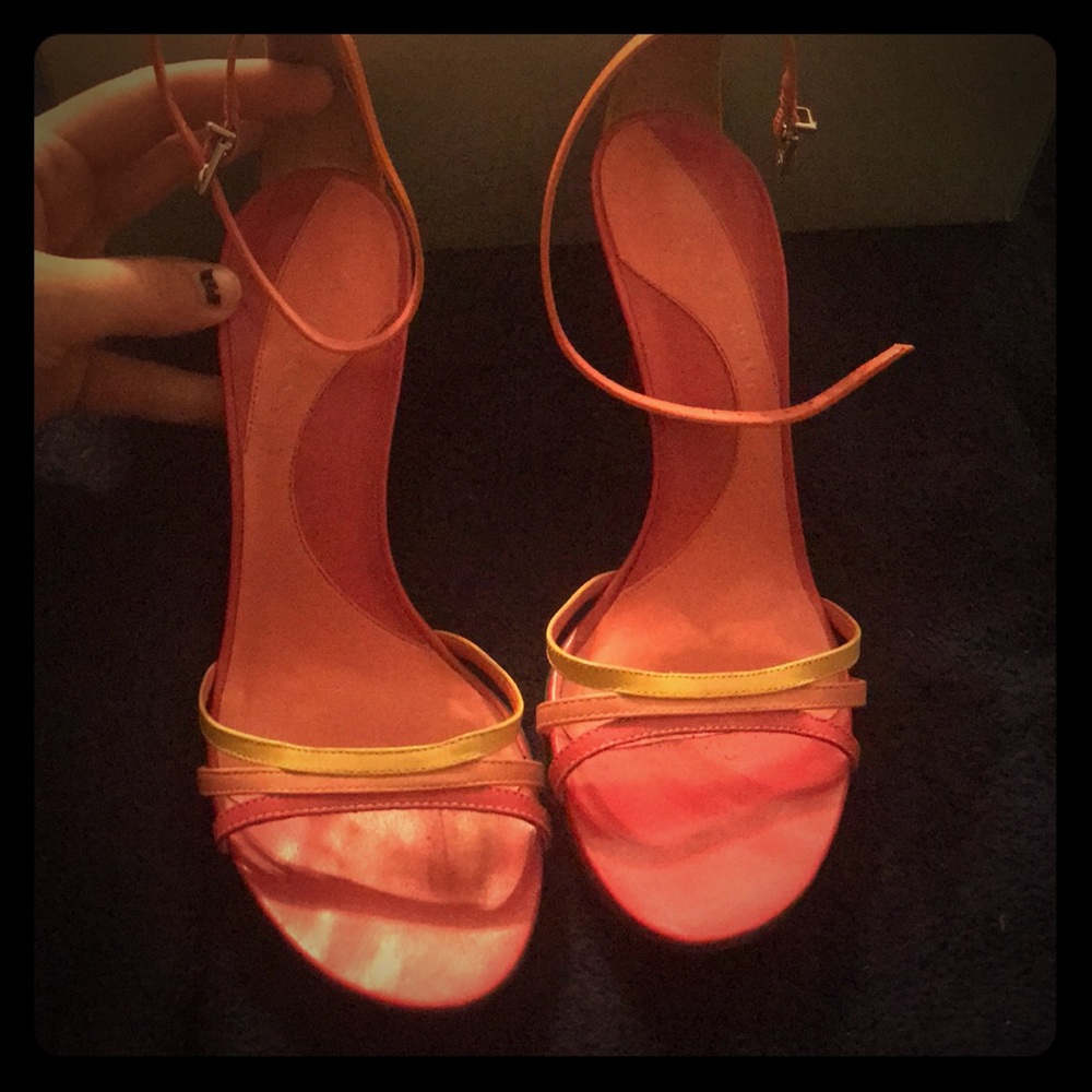 Yellow, coral, and hot pink spiked heels